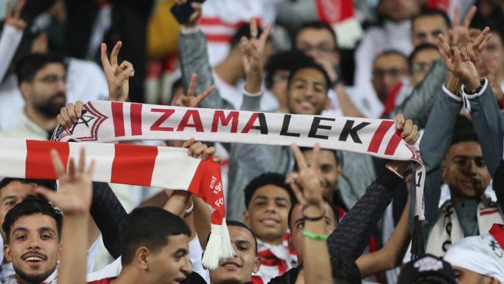 Zamalek fans wave a scarf